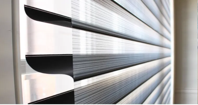 Close-up of triple shade vanes floating between two sheers
